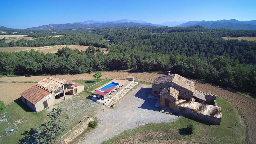 an aerial view of a house with a swimming pool at Casa Rural Sant Joan in Olíus