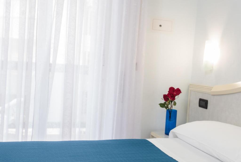 Postel nebo postele na pokoji v ubytování Hotel Oriente