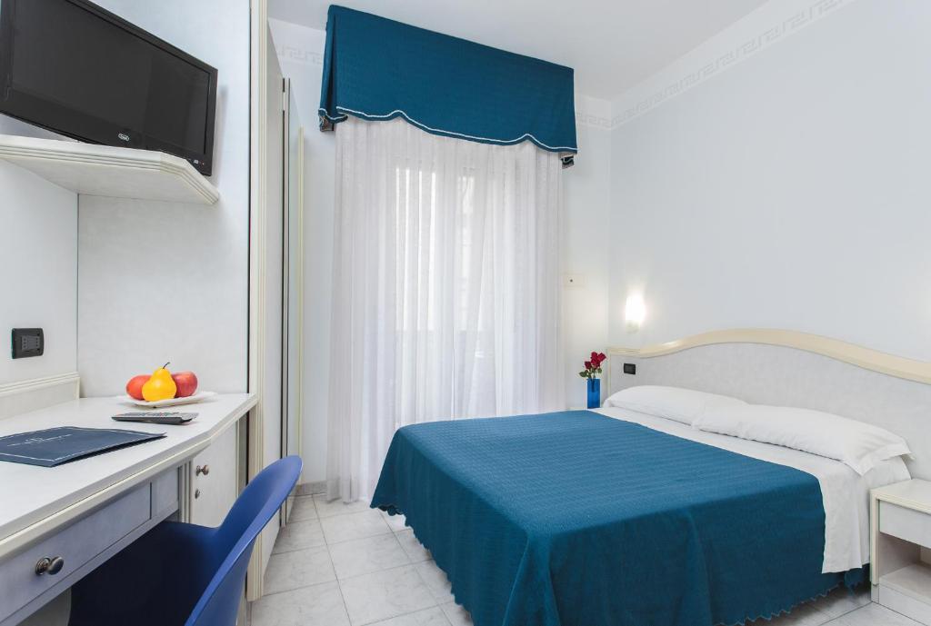 Postel nebo postele na pokoji v ubytování Hotel Oriente
