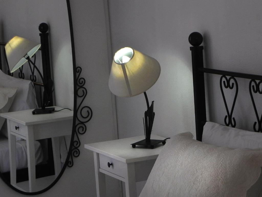Postel nebo postele na pokoji v ubytování Ulysses Hotel