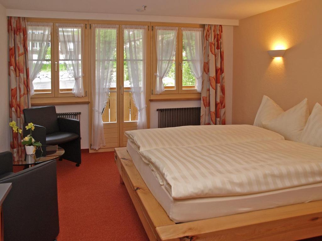 Postel nebo postele na pokoji v ubytování Hotel Steinbock