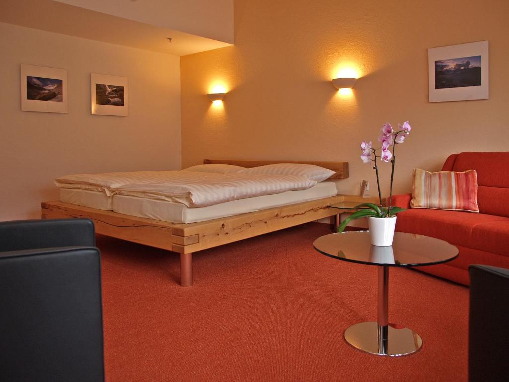 Postel nebo postele na pokoji v ubytování Hotel Steinbock