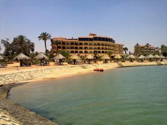 a hotel on the beach with a resort at Fayed Armed Forces Hotel in Fayed