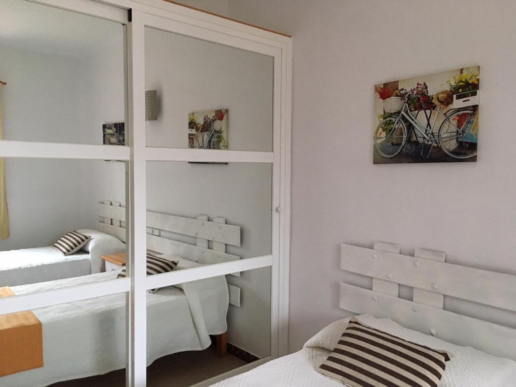 A bed or beds in a room at Viviendas Los Olivos - Formentera Break
