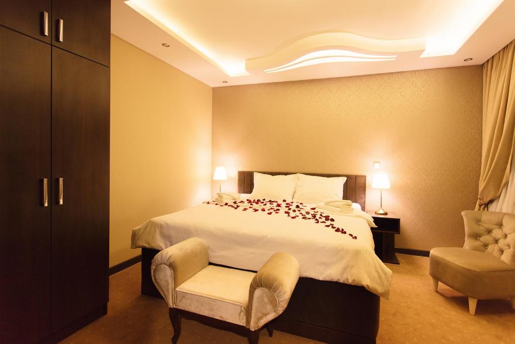 Postel nebo postele na pokoji v ubytování Garni Hotel President de Luxe