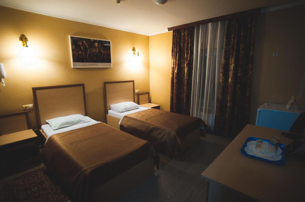 Кровать или кровати в номере Гостиница Садко