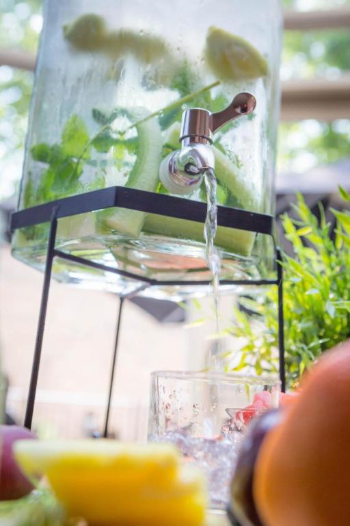 a water faucet pouring water into a glass at Maldron Hotel Kevin Street, Dublin City in Dublin