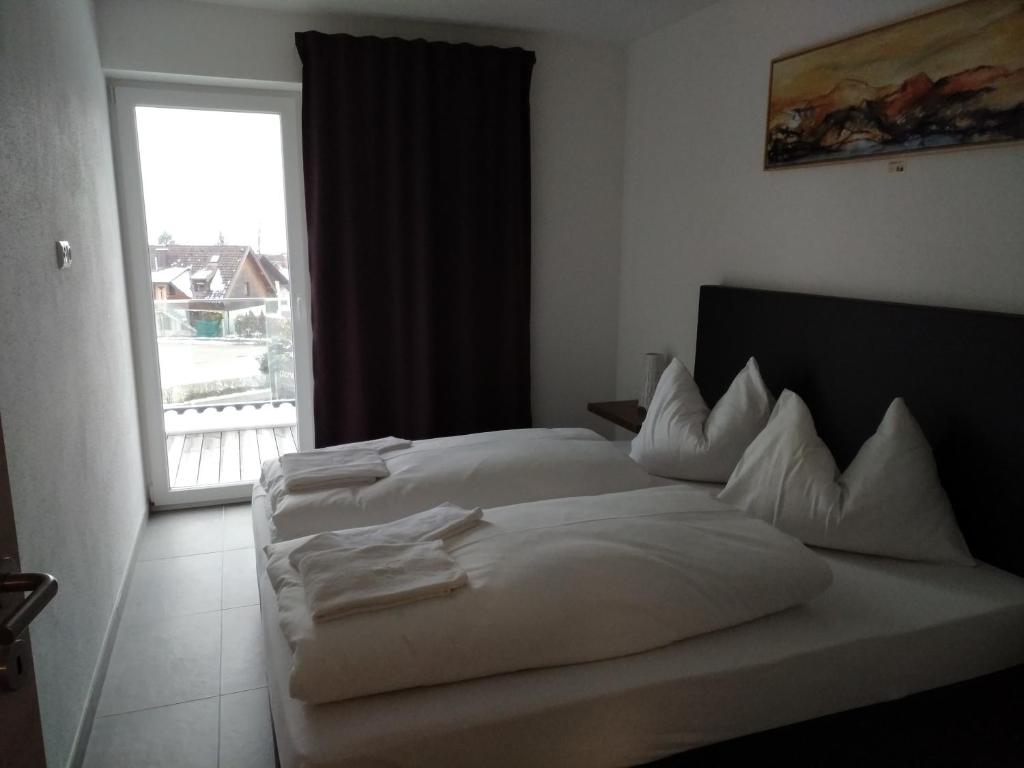 Postel nebo postele na pokoji v ubytování Hotel Restaurant Sailer