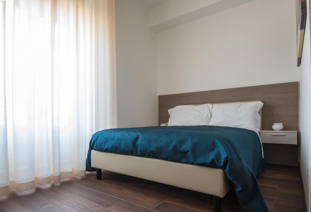 Postel nebo postele na pokoji v ubytování Enjoy Milano Skyline