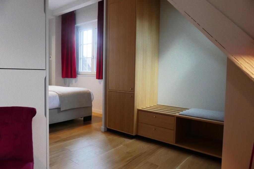 Postel nebo postele na pokoji v ubytování Aigle d'Or - Strasbourg Nord