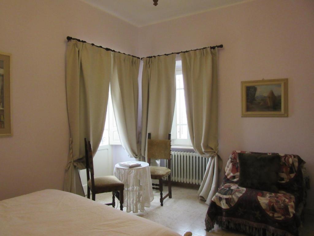 Posteľ alebo postele v izbe v ubytovaní Dimora Il Palazzetto