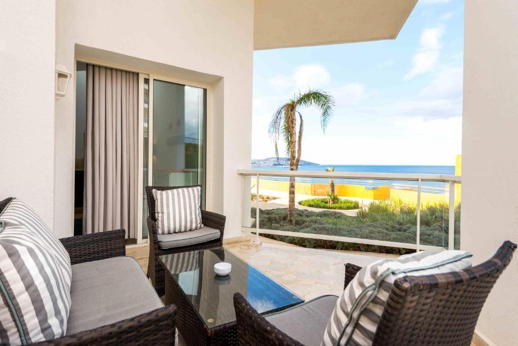 a living room with a view of the ocean at Hotel Farah Tanger in Tangier