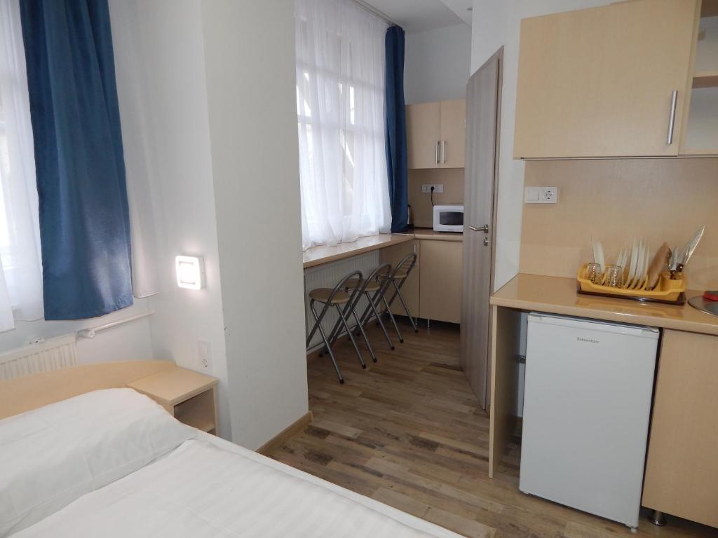 A kitchen or kitchenette at Kálvin Vendégszobák