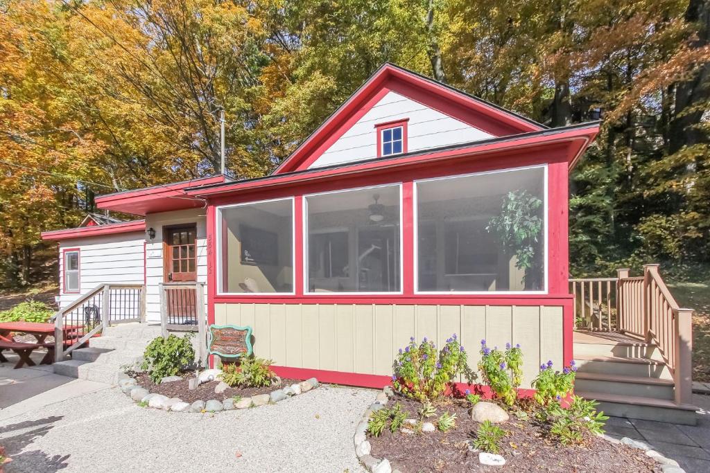a tiny house with a red and white at The Swallow in Saugatuck