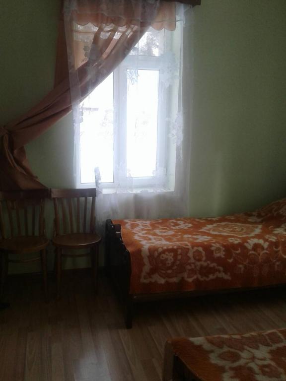 Postel nebo postele na pokoji v ubytování Mila Guest House