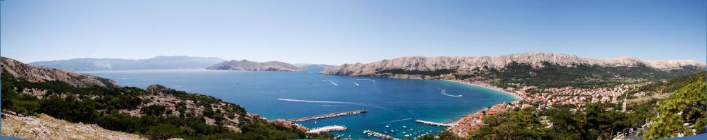 a view of a bay with boats in the water at Apartments and rooms Bova in Baška