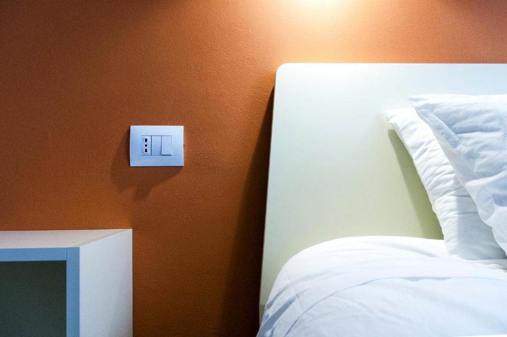 Postel nebo postele na pokoji v ubytování VILLA FENIX OSIO SOTTO