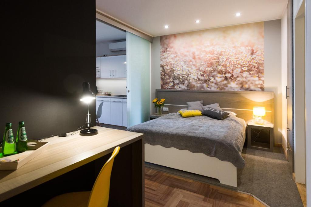 Posteľ alebo postele v izbe v ubytovaní Sunflower Apartment