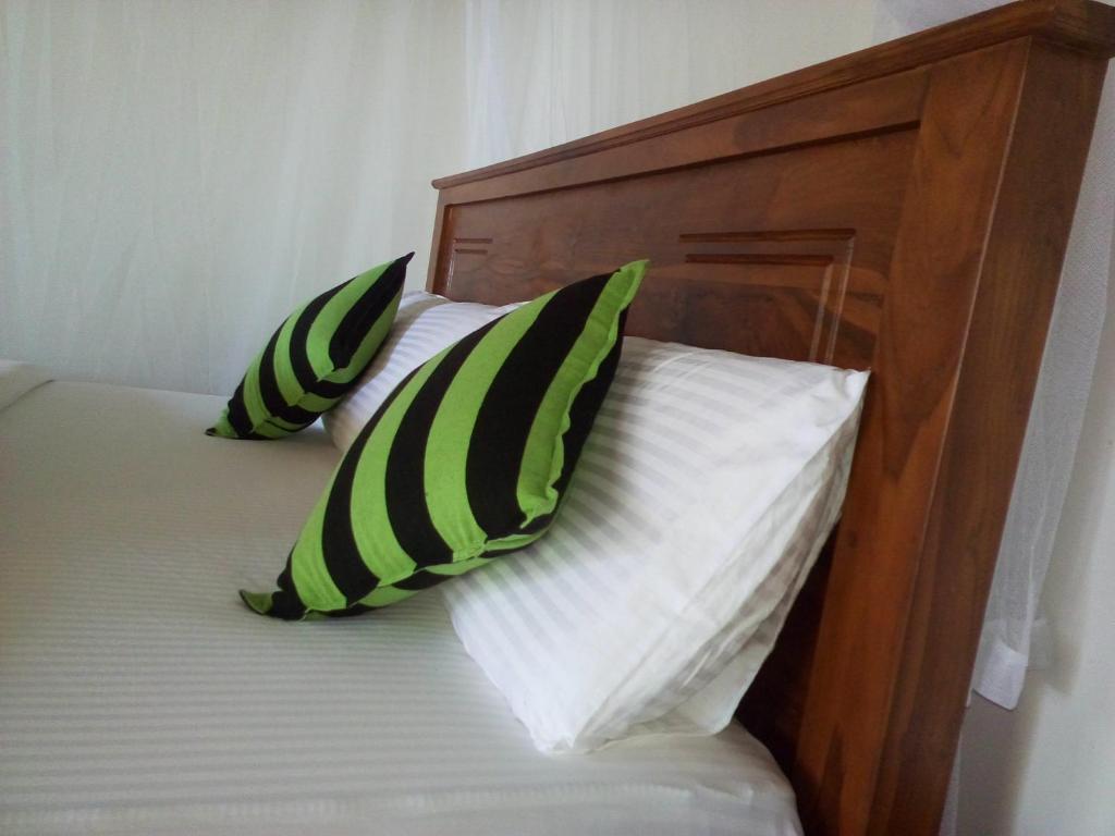 Postel nebo postele na pokoji v ubytování Blue Ribbon Homestay