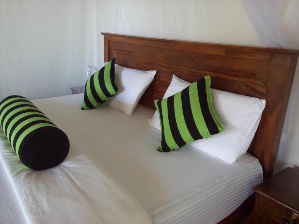 Postel nebo postele na pokoji v ubytování Blue Ribbon Homestay