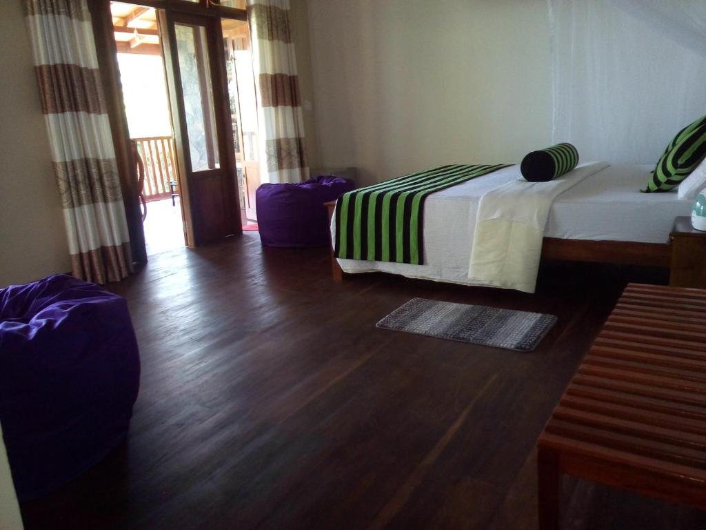 Postel nebo postele na pokoji v ubytování Blue Ribbon Homestay