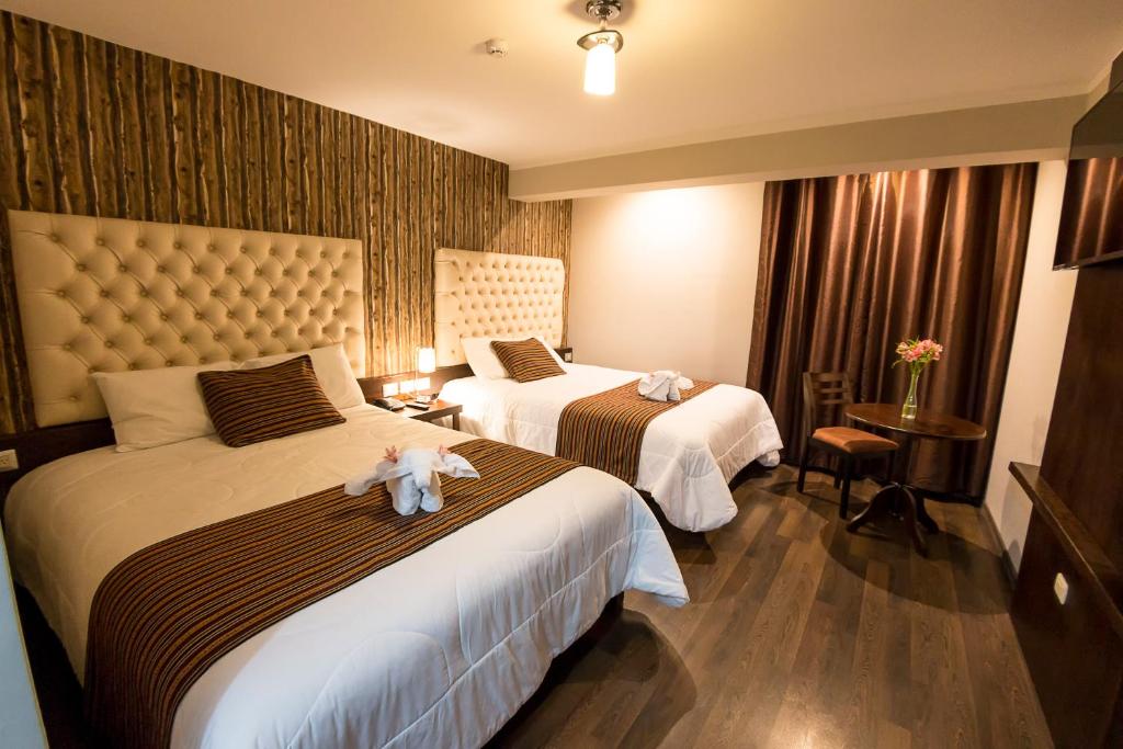 Katil atau katil-katil dalam bilik di Ureta Hotel