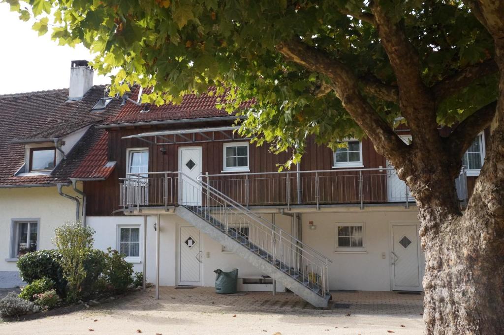 a house with a staircase in front of it at BodenSEE Apartment 1 - 4 Meersburg Daisendorf in Daisendorf