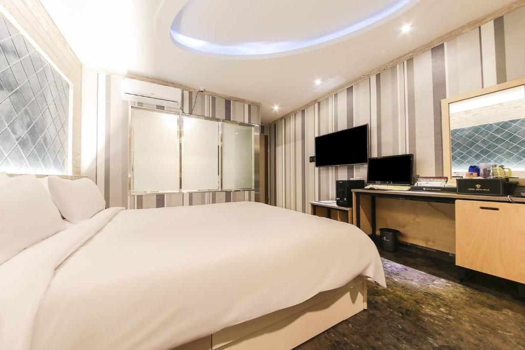 TV a/nebo společenská místnost v ubytování Hotel TopsVille