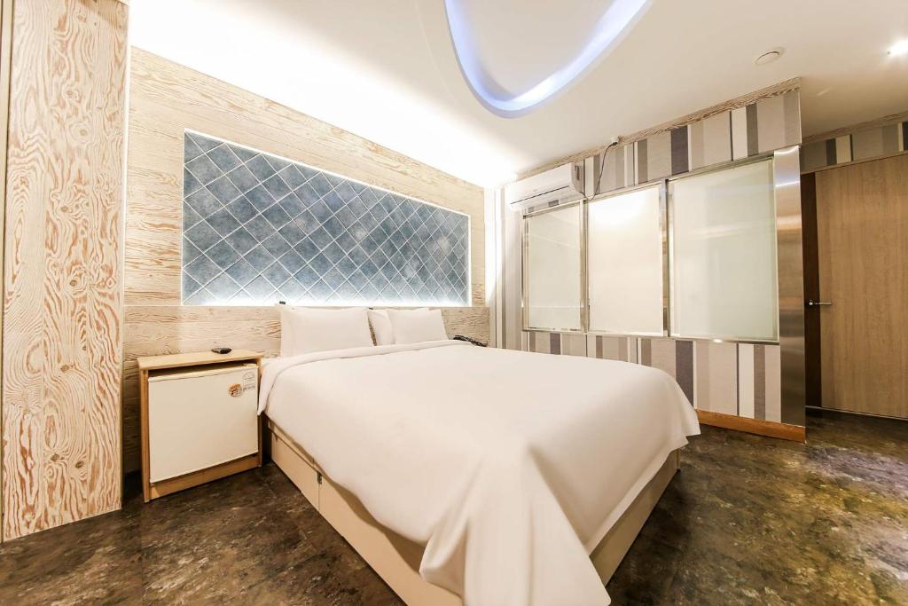 Postel nebo postele na pokoji v ubytování Hotel TopsVille