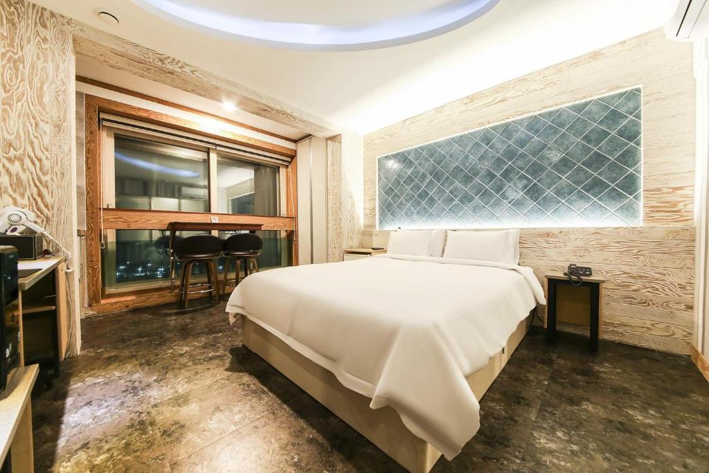 Postel nebo postele na pokoji v ubytování Hotel TopsVille