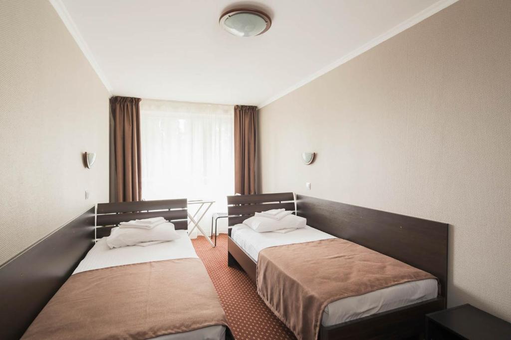 Postel nebo postele na pokoji v ubytování Отель Сочи