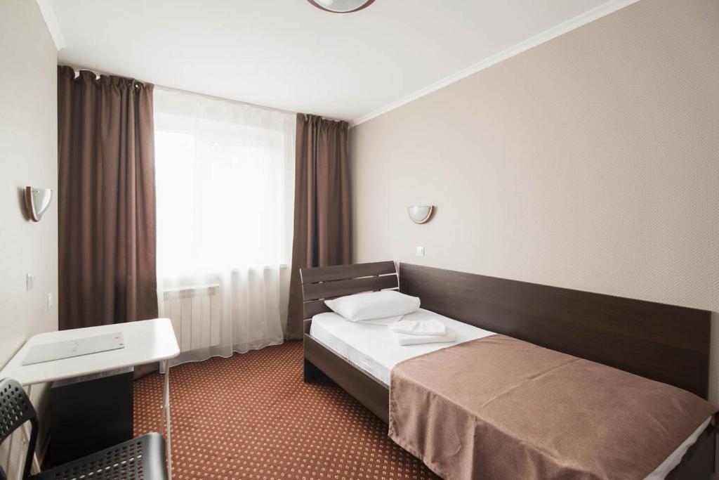 Postel nebo postele na pokoji v ubytování Отель Сочи