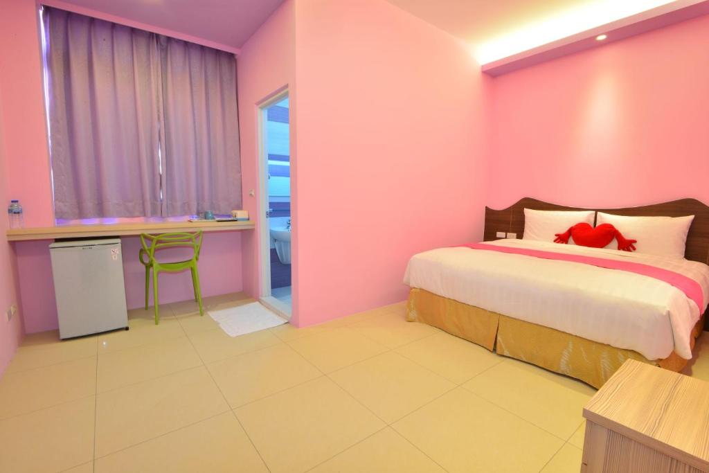 Postel nebo postele na pokoji v ubytování Mu Yu B&B