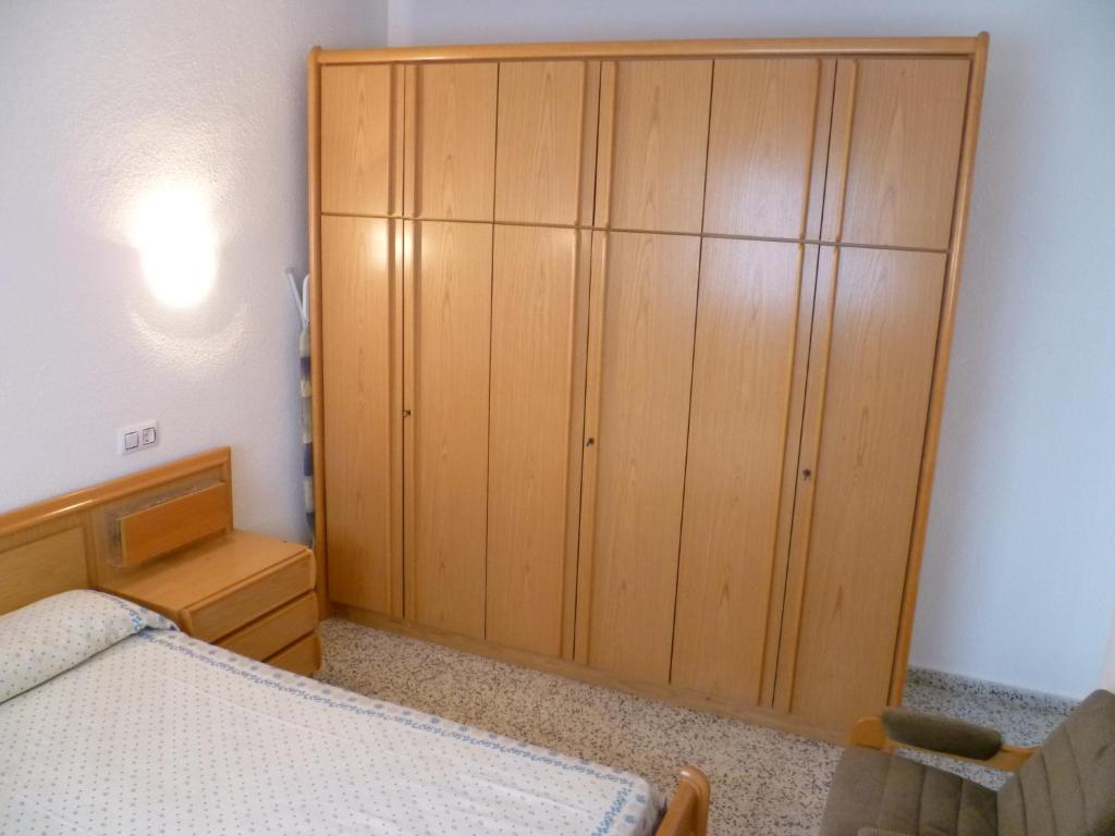 A bed or beds in a room at Miralmar, 10º-69