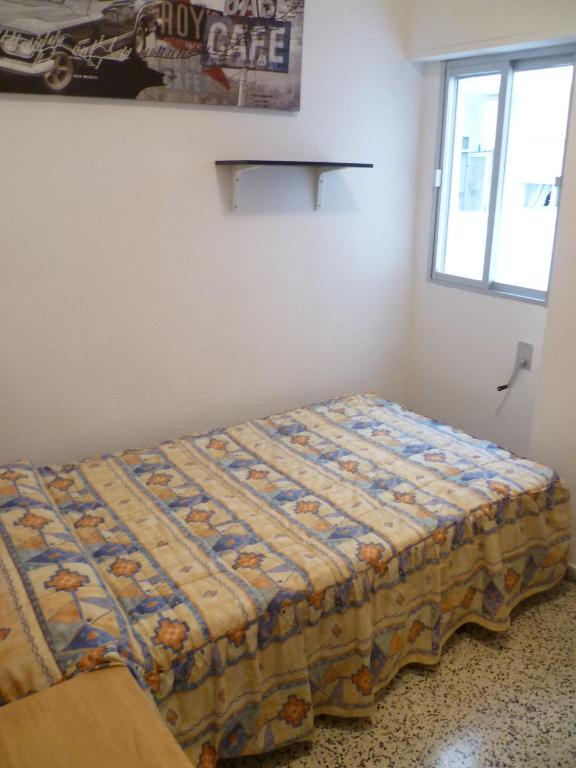 A bed or beds in a room at Miralmar, 10º-69