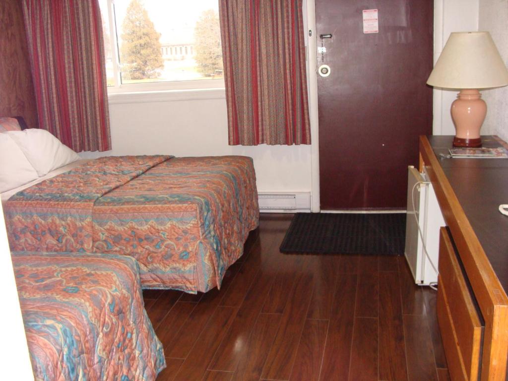 Postel nebo postele na pokoji v ubytování Lion Motel