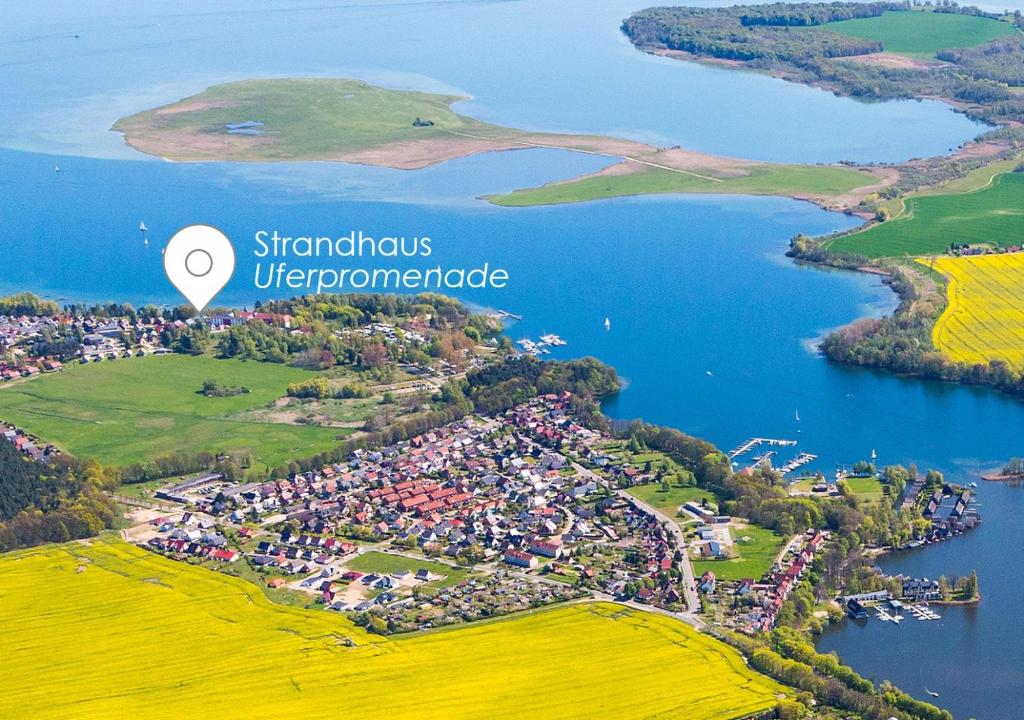 an aerial view of a town next to a lake at Müritzblick 36 in Röbel