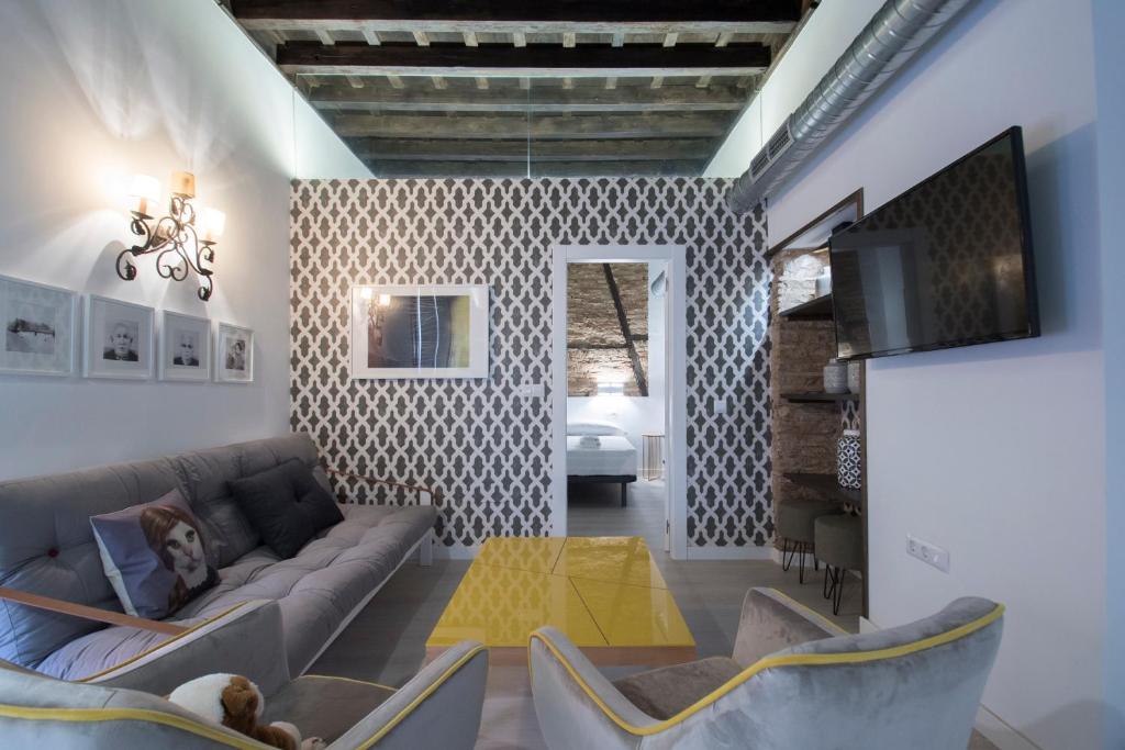 Televízia a/alebo spoločenská miestnosť v ubytovaní Apartamentos Real Suites Realejo