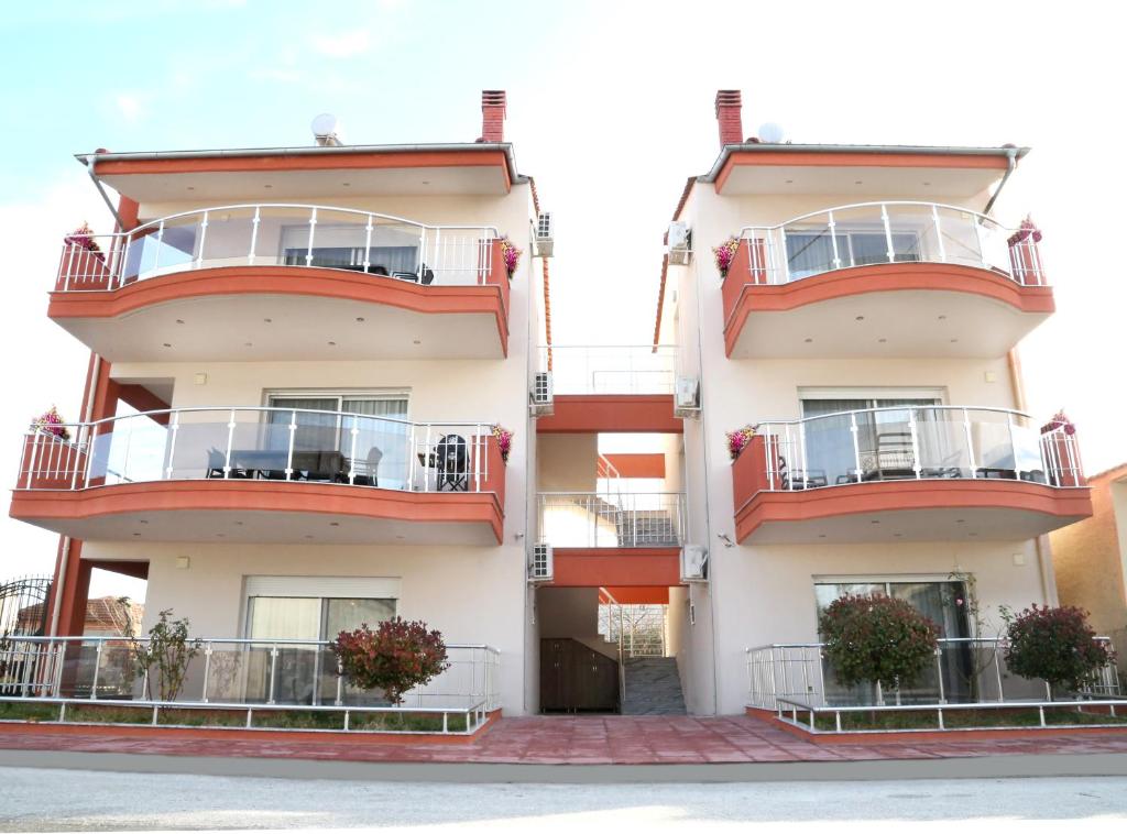 an image of a building with balconies at Sinanis Family Apartments in Keramoti