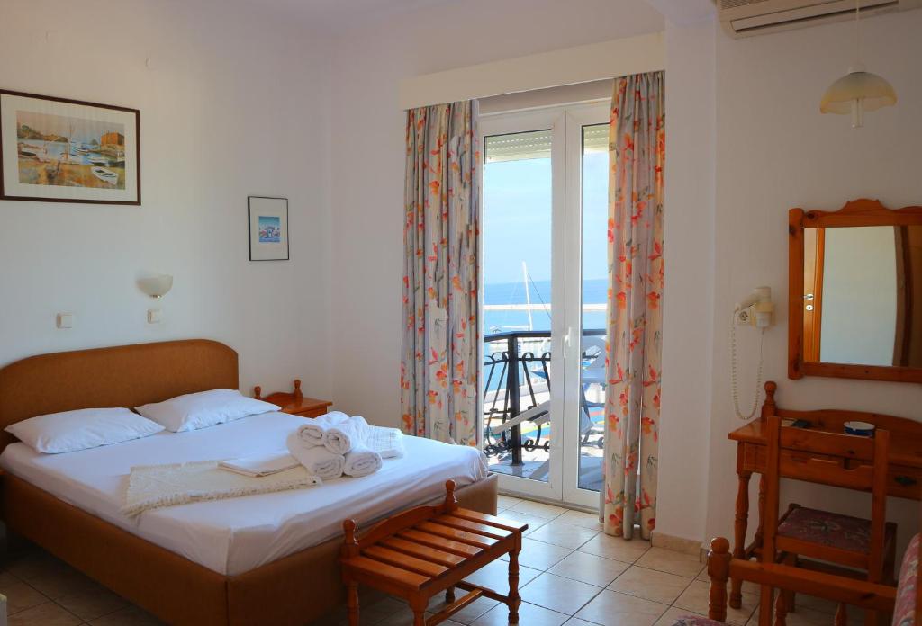 Postel nebo postele na pokoji v ubytování Akti Hotel