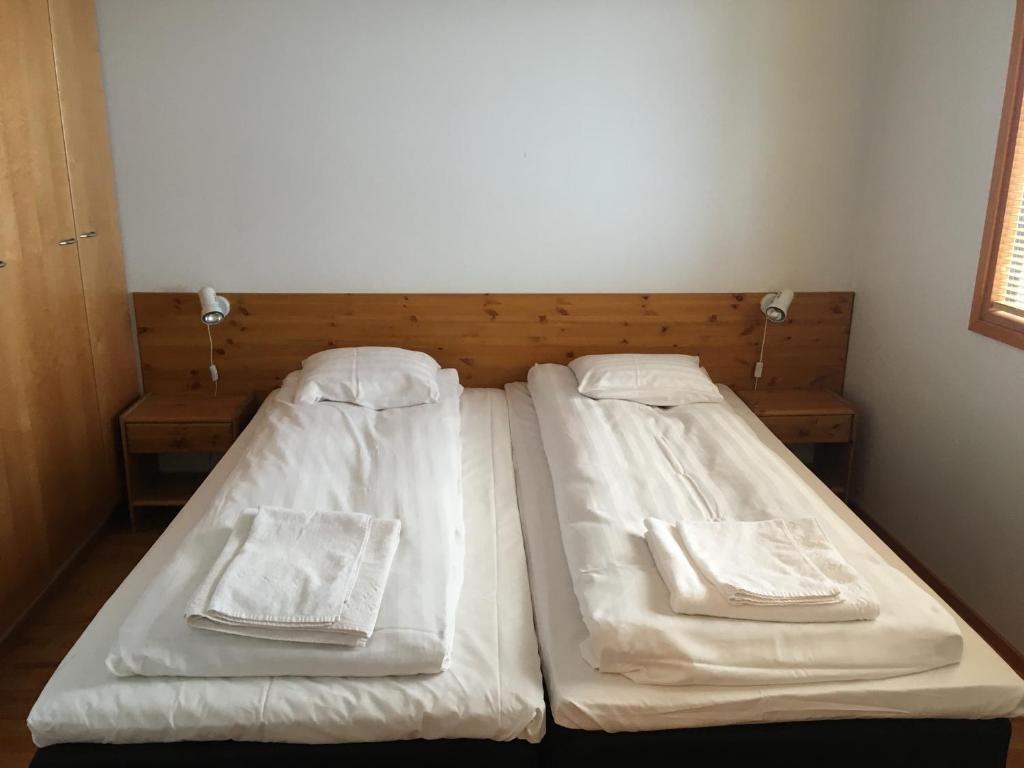 Кровать или кровати в номере Rukariutta Apartments