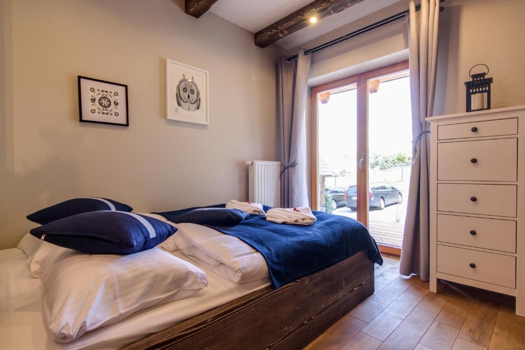 Posteľ alebo postele v izbe v ubytovaní Apartamenty Smrekowa Lux Zakopane
