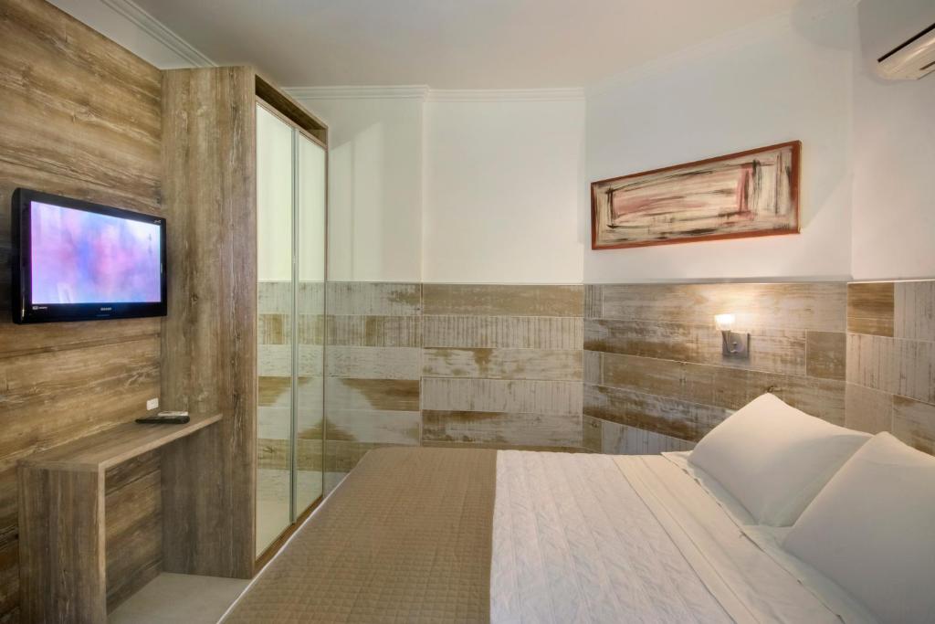 Cama ou camas em um quarto em Pousada Bora Bora