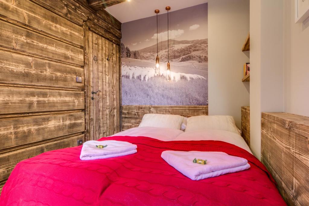 Posteľ alebo postele v izbe v ubytovaní Apartamenty Smrekowa Lux Zakopane