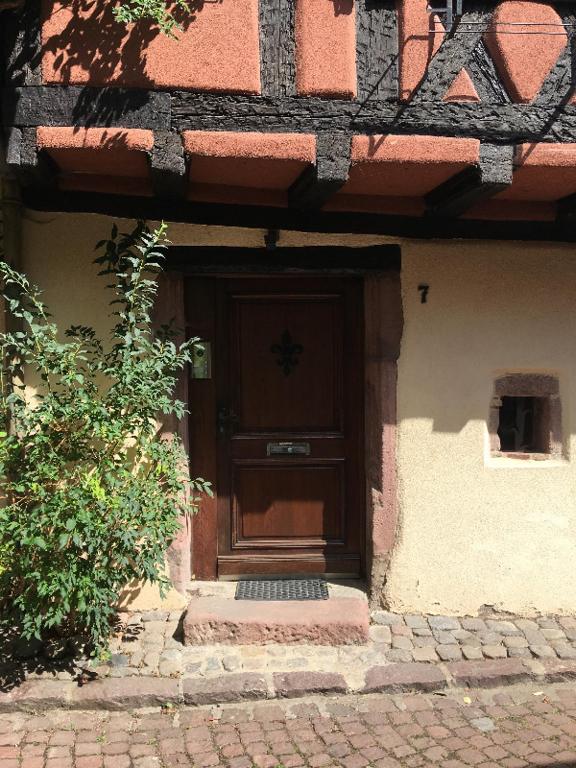 a front door of a house with a brick walkway at KAYSERSBERG city center - House &quot;AUX 7 FORGERONS&quot; - in Kaysersberg