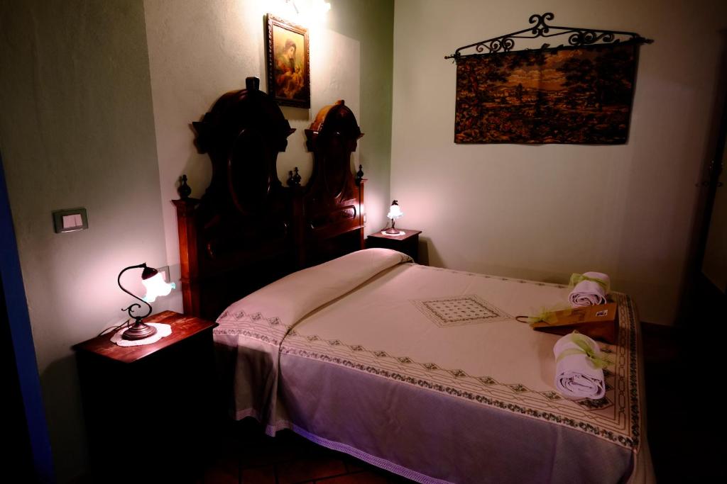 Ένα ή περισσότερα κρεβάτια σε δωμάτιο στο Agriturismo la Strozza