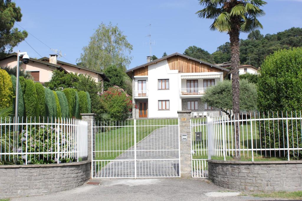 a white gate in front of a house at Ranco Villa Lina in Ranco