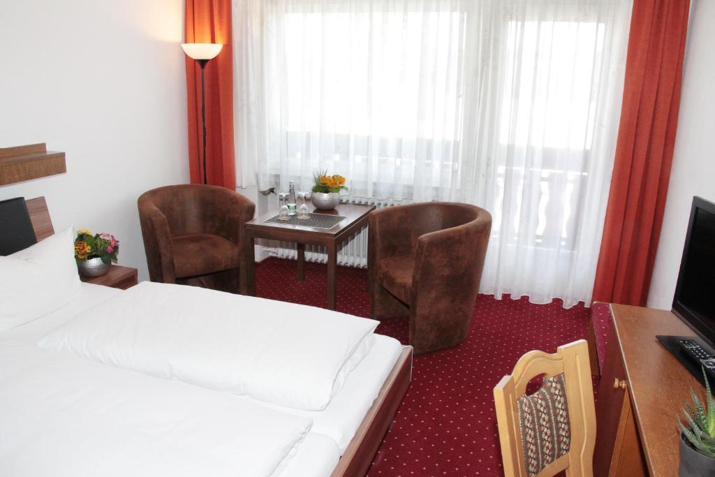 Posezení v ubytování Hotel an der Sonne & Restaurant Zum Schneiger