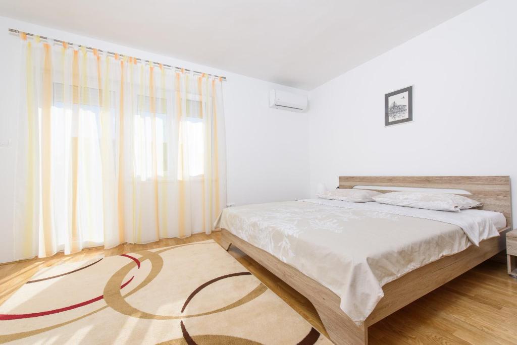Posteľ alebo postele v izbe v ubytovaní Apartment Kate