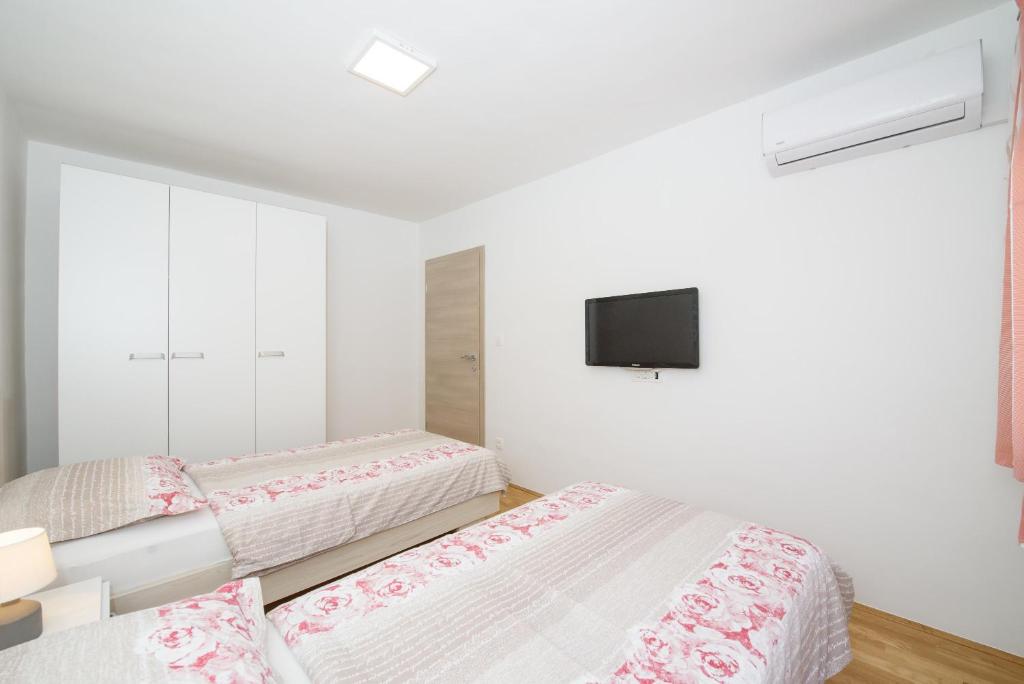 Posteľ alebo postele v izbe v ubytovaní Apartment Kate